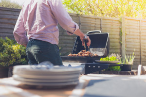 Plates on a table outside with man in background