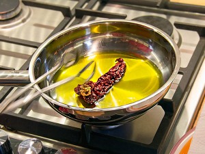 Frying the dried peppers