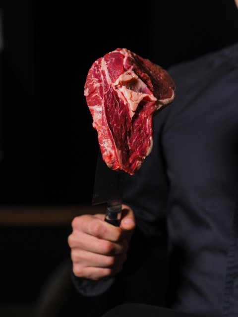 porterhouse steak on knife