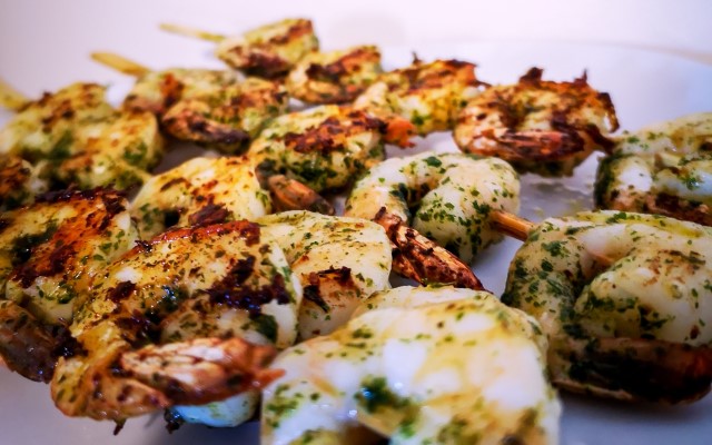 spicy grilled shrimp kabobs on plate